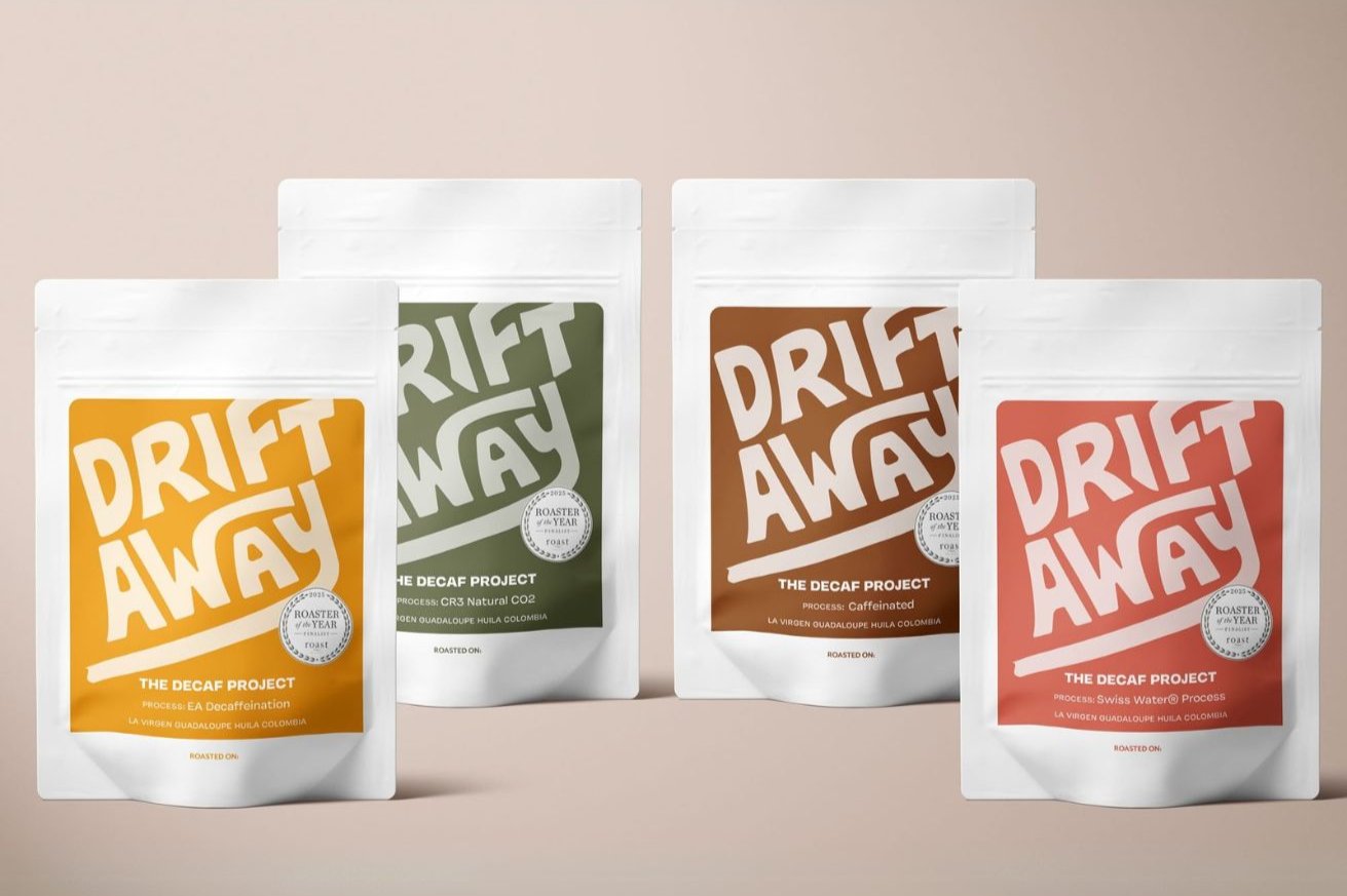 Four coffee bags side by side representing different decaf methods